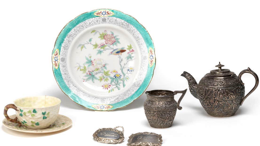 Objects from NMI's handling collection, including ceramics cups and plates, silver drinks labels, teapot, and milk jug