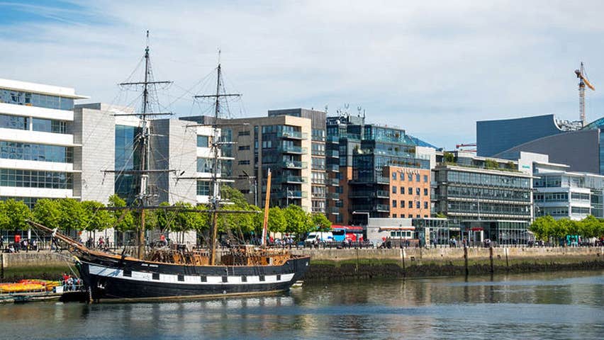 A view of the Jeanie Johnston docked on the Custom House Quay in Dublin's Docklands with a view of the Convention Centre in the background