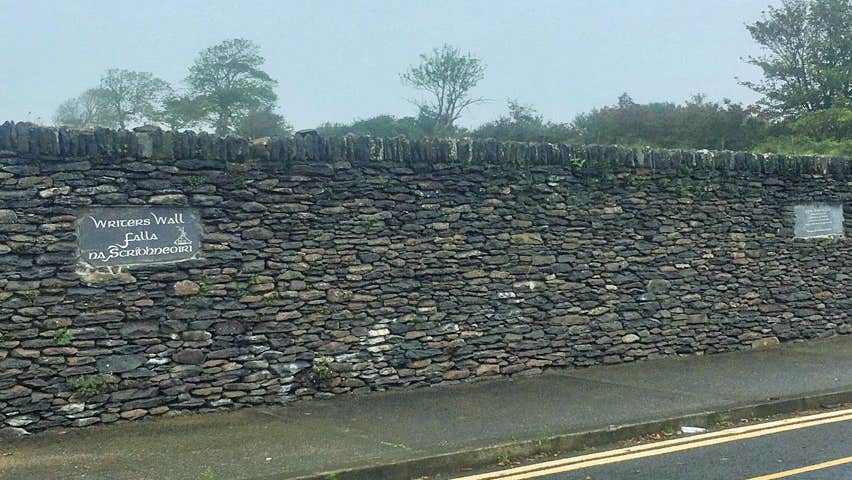 A view of the Writers Wall in Dingle showing two of the tribute plaques