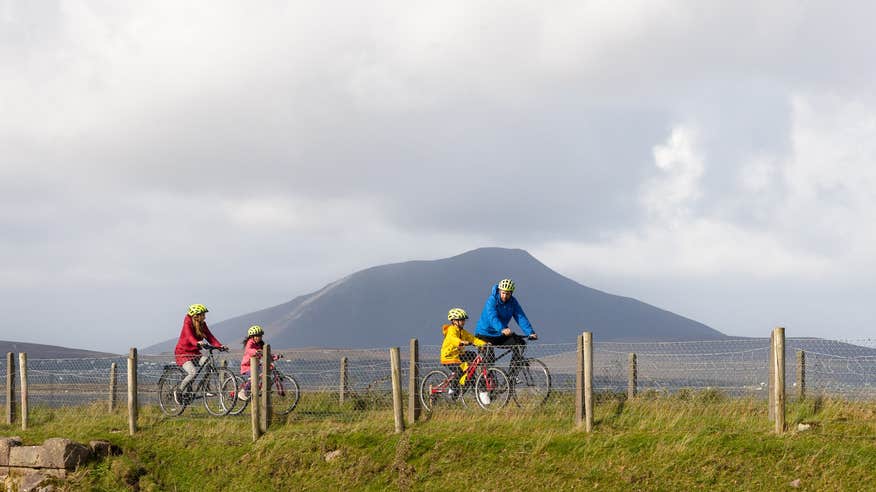 A family cycling the Great Western Greenway in County Mayo