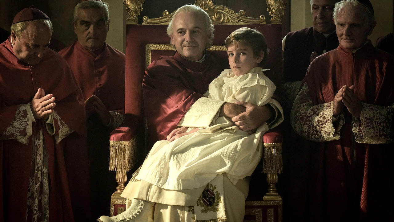 A child is sitting on the lap of the Pope with other priests around them.