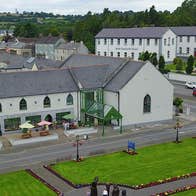 Aerial view of Tour Ard Theatre in front of the village green in Moate, County Westmeath