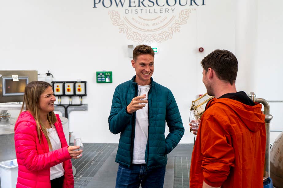 Three people touring the Powerscourt Distillery in County Wicklow.