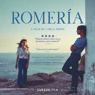 Film poster with 2 people standing on rocky area with sea in the background.