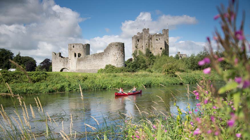 People canoeing past Trim Castle in Co Meath