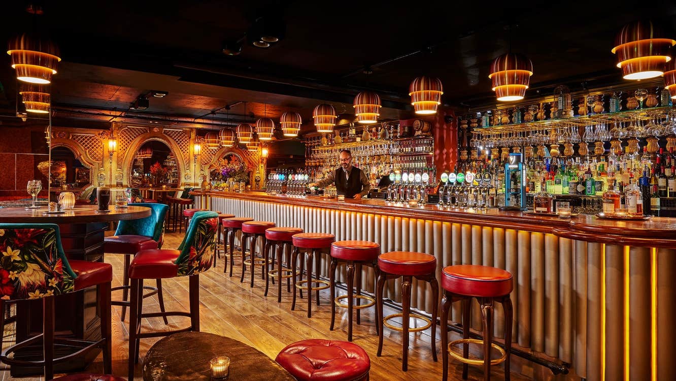 The trendy bar at Bartley's with brown and golden decor and hues throughout