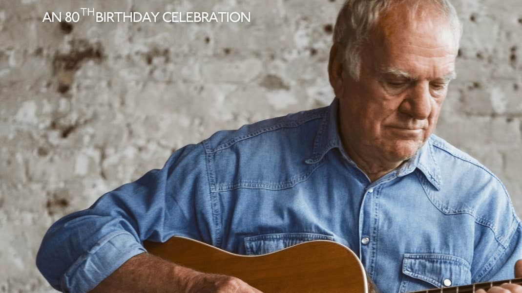 Ralph McTell Strumming his guitar.