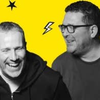 Black and white photo of 2 laughing men