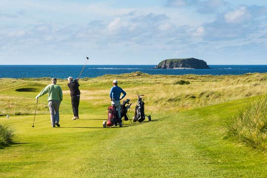Golfers at Ballyliffin Golf Course in County Donegal