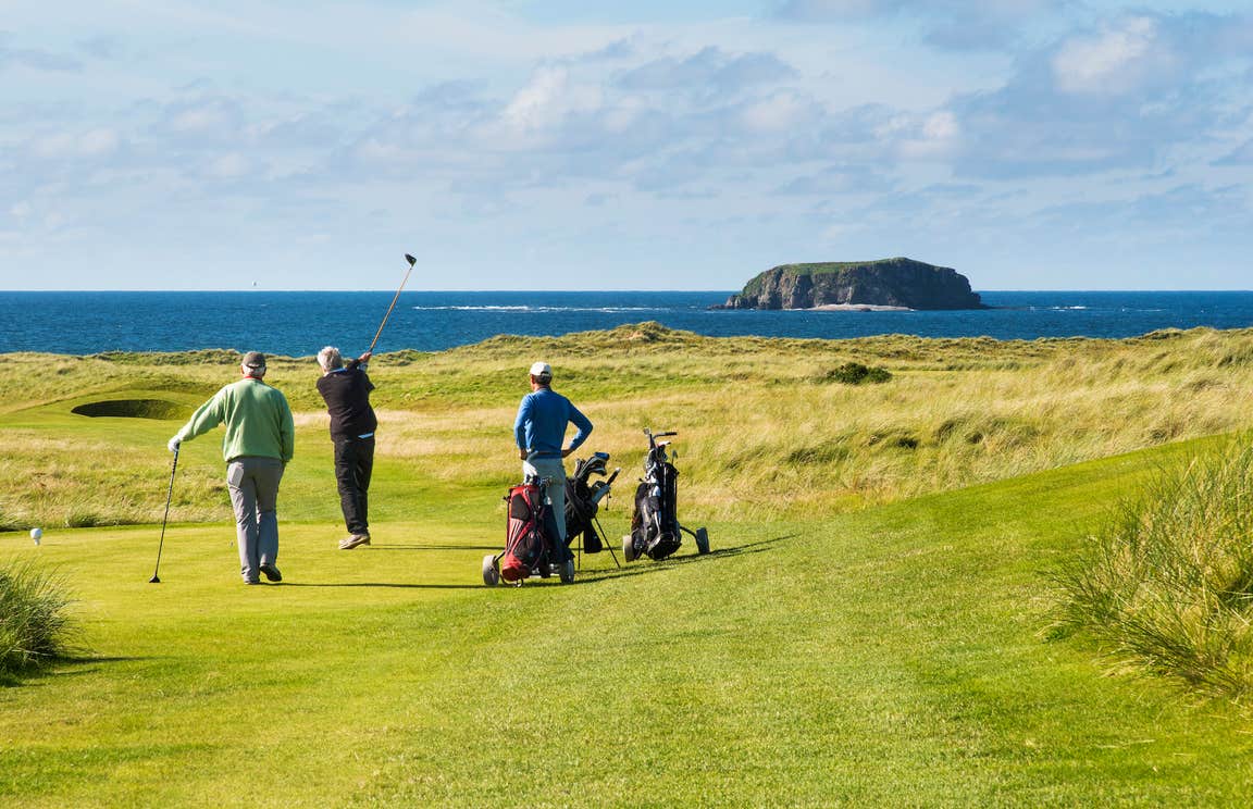 Golfers at Ballyliffin Golf Course in County Donegal