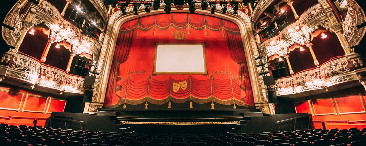 A view of a theatre stage from the front row