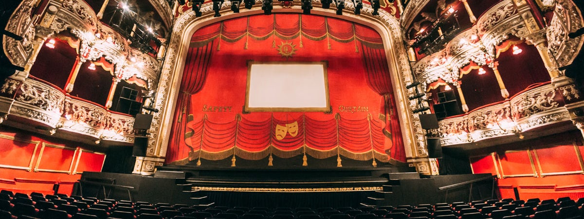 A view of a theatre stage from the front row