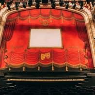 A view of a theatre stage from the front row