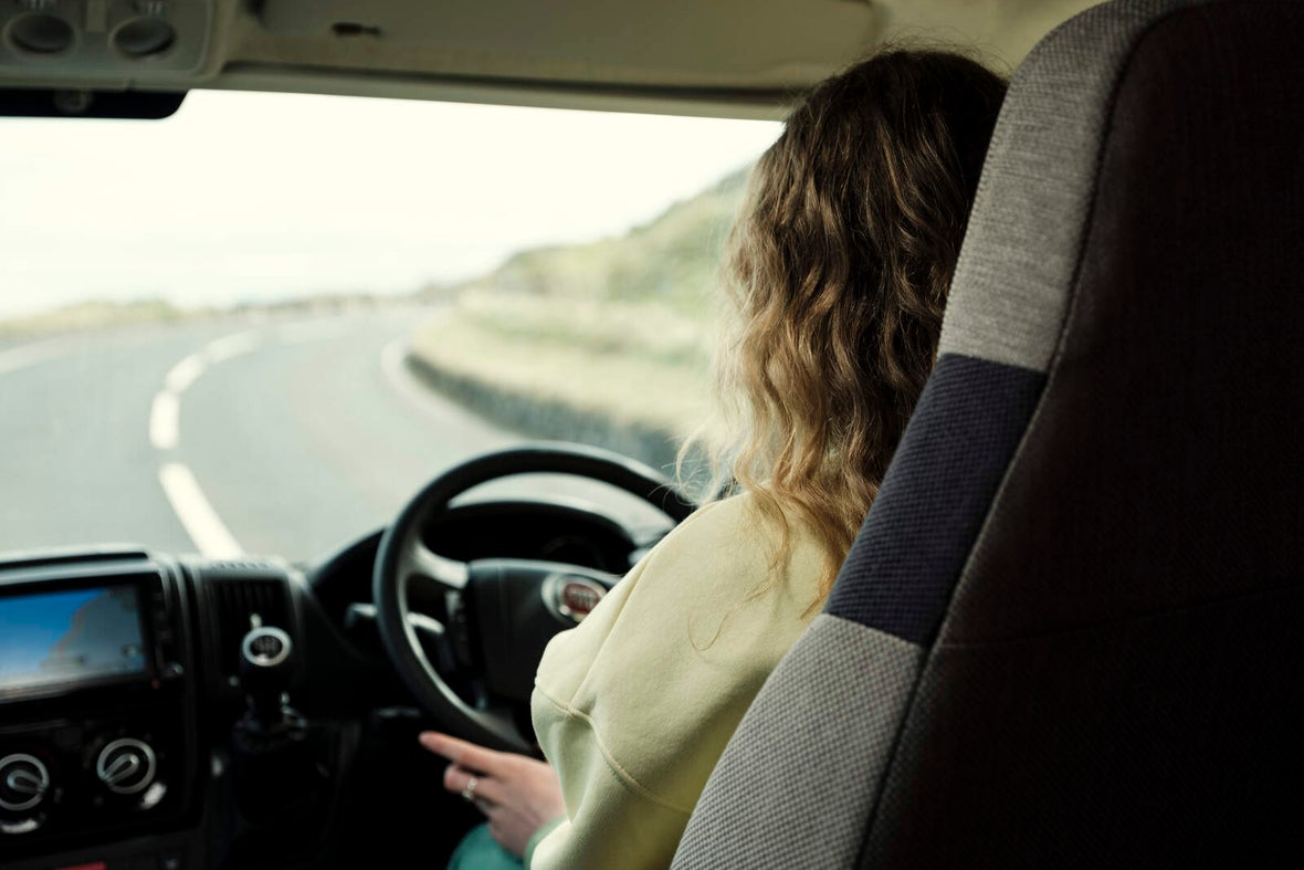 Image of a woman driving a camper van.