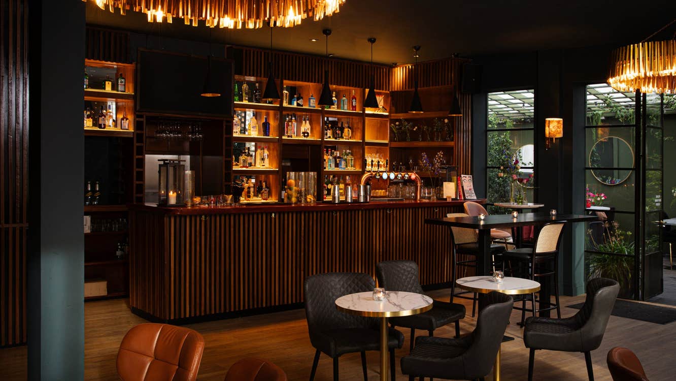 A view of the cocktail bar and ground floor terrace at Lottie's restaurant