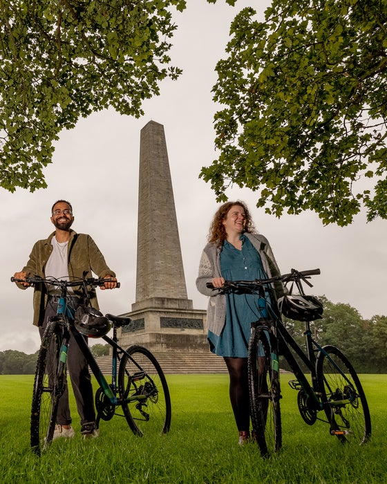 A couple cycling in Phoenix Park