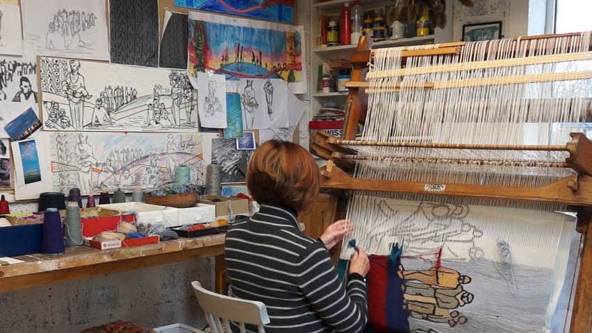 Frances Crowe weaving a tapestry at her Dryad loom