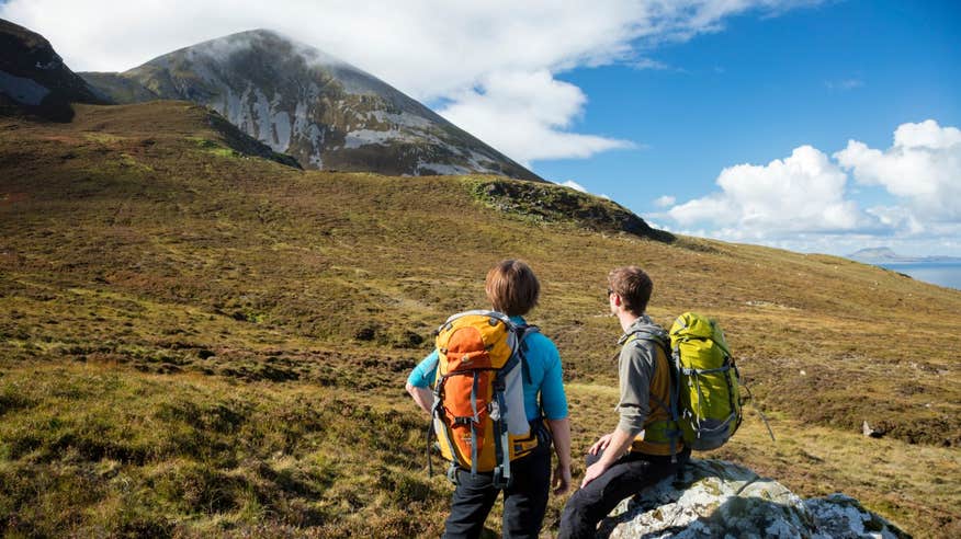 Two people preparing for the ascent up Croagh Patrick, County Mayo