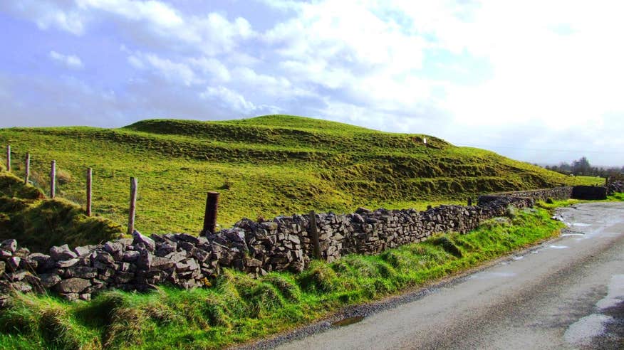 An flat-topped circular mound covered in grass at Rathcroghan in Roscommon