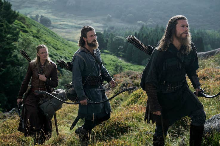 A scene from the Vikings series, featuring three vikings on a hill.