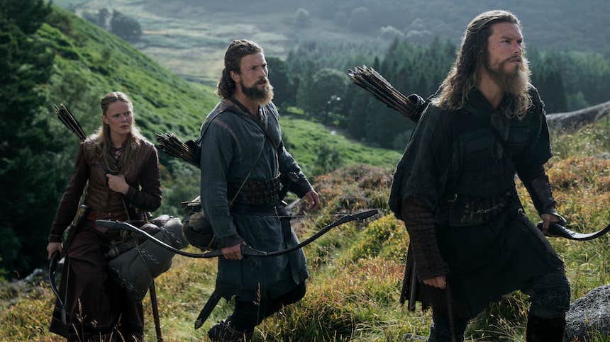 A scene from the Vikings series, featuring three vikings on a hill.