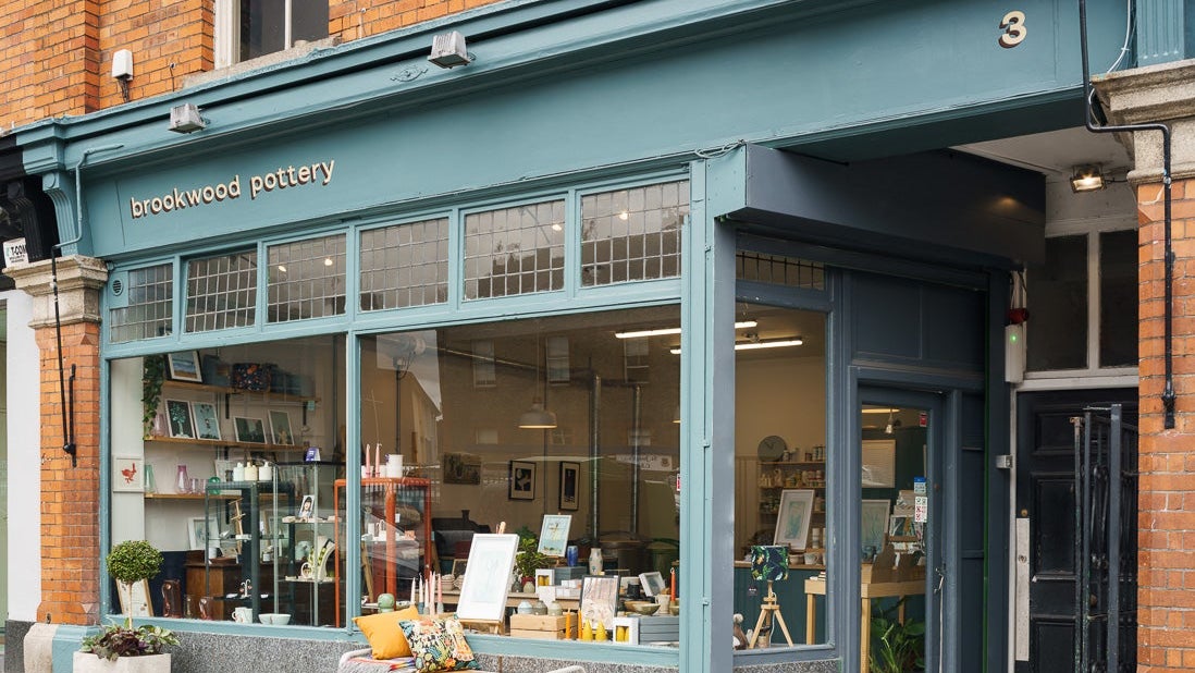 The green shopfront exterior of Brookwood Pottery