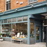 The green shopfront exterior of Brookwood Pottery