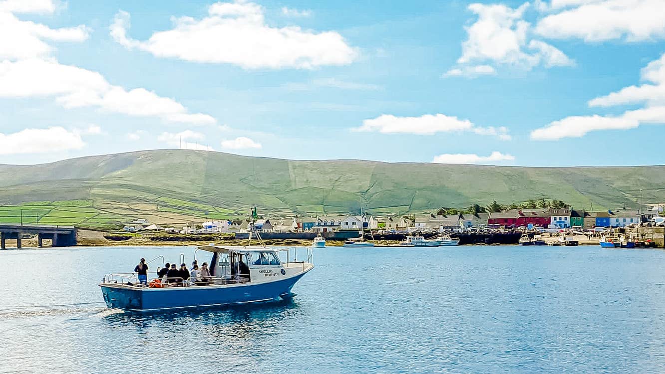 The Skellig Bounty boat in Valentia Harbour with people on a tour