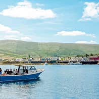 The Skellig Bounty boat in Valentia Harbour with people on a tour