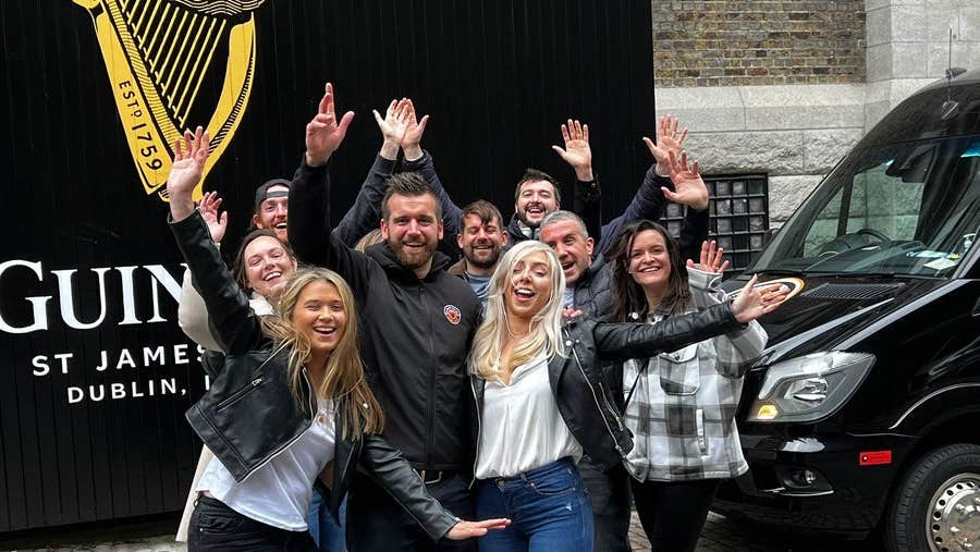 A group of people outside St James Gate in Dublin City