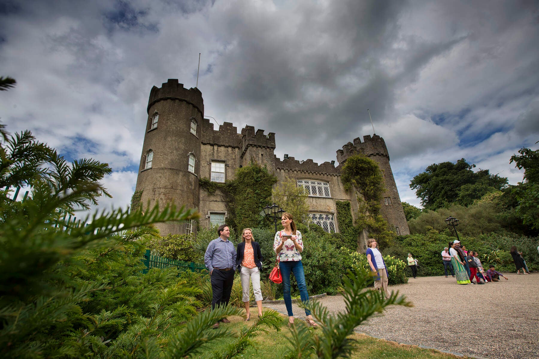 Group of people standing outside Malahide Castle and Gardens.