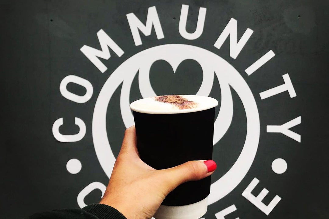 Cup of coffee against logo