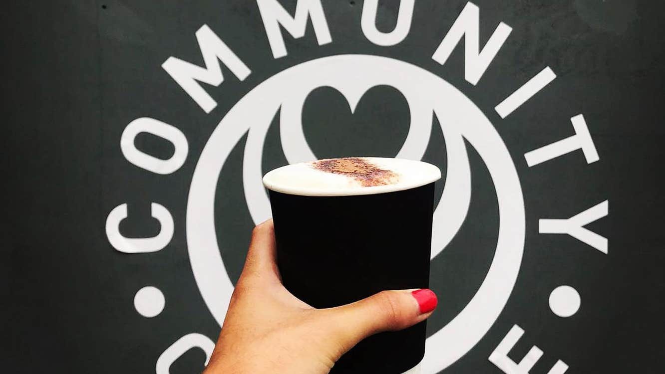 Cup of coffee against logo