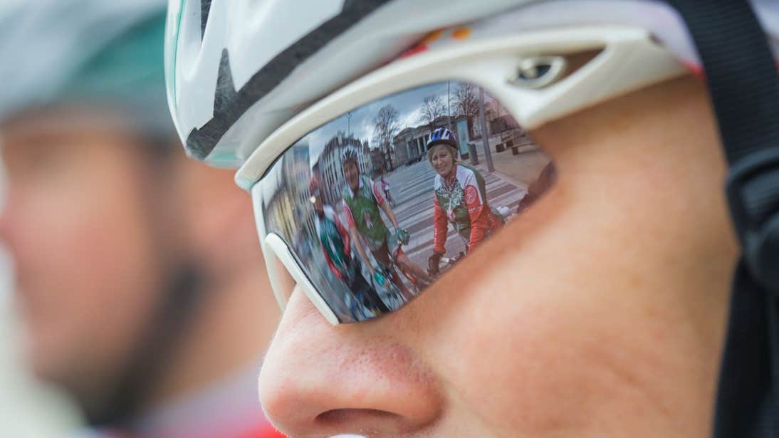 A close-up view of cyclists wearing helmets