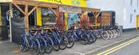 A row of bicycles outside carlingford greenway bicycle hire shopfront
