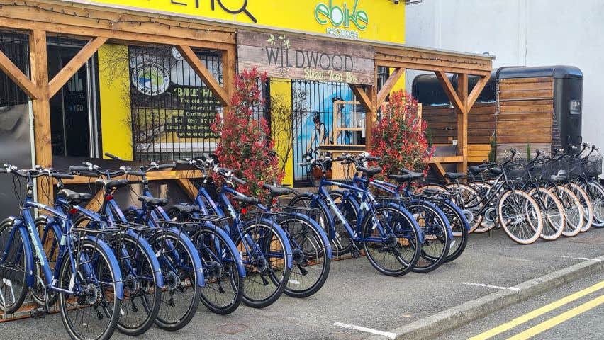 A row of bicycles outside carlingford greenway bicycle hire shopfront