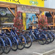 A row of bicycles outside carlingford greenway bicycle hire shopfront