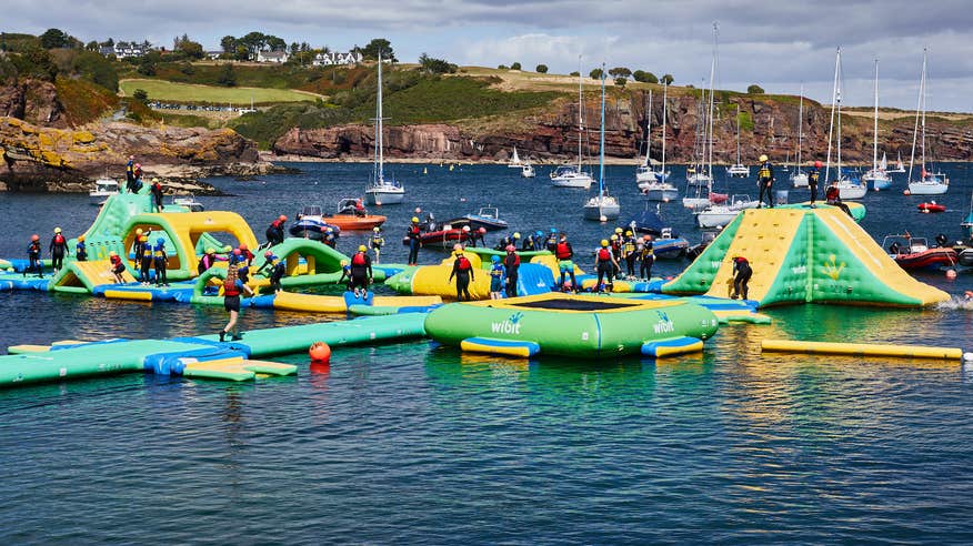 People on the inflatable obstacle course at Dunmore East Adventure Centre, Co Waterford