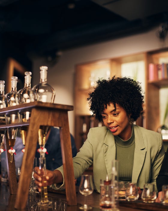 A woman on a tour of the Roe & Co Whiskey Distillery in Dublin