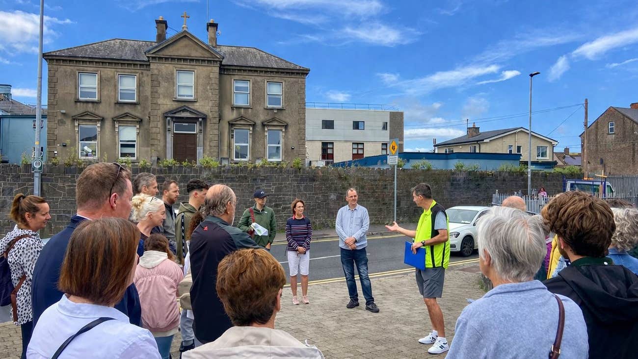 A group of people listening to their guide with Treaty Walking Tours