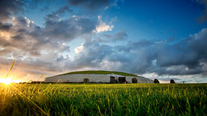 Sunrise at Newgrange in a grassy field