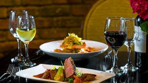 Table with salmon and duck dishes