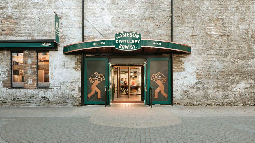 Entrance into Bow Street Jameson Distillery, featuring a green decorated entrance with the Jameson branding around.