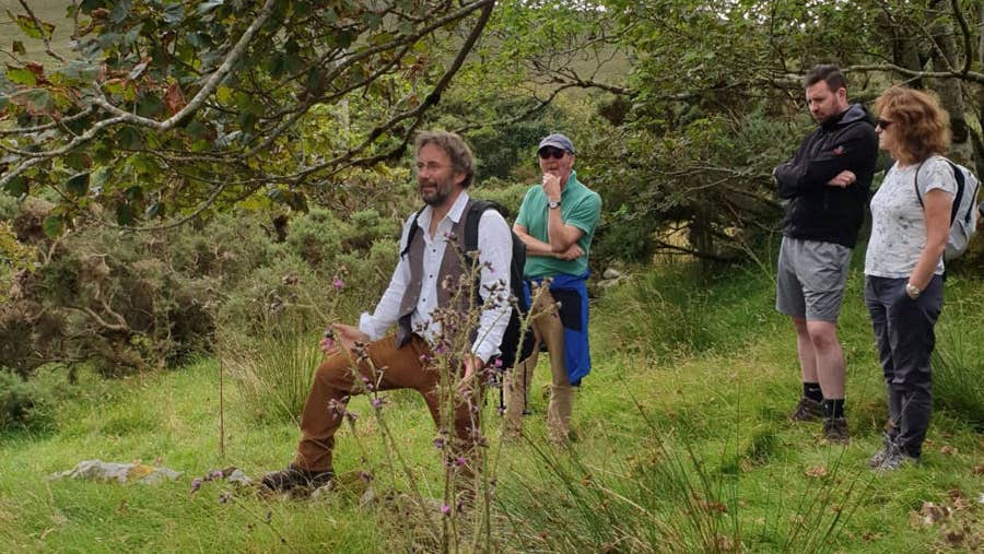 People enjoying The Colony Tour and exploring the historic ruins of the Achill Mission