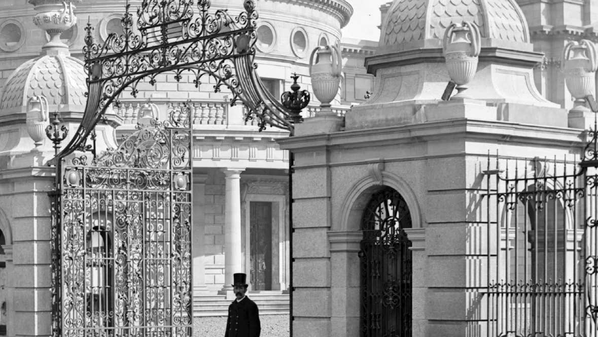 Cut & Paste No. 9 2026: Remembering Arthur Griffith, old black and white photo of gentleman walking through ornate iron gates from a Georgian building.
