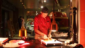 Image of chef preparing Pizza