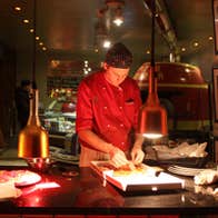 Image of chef preparing Pizza