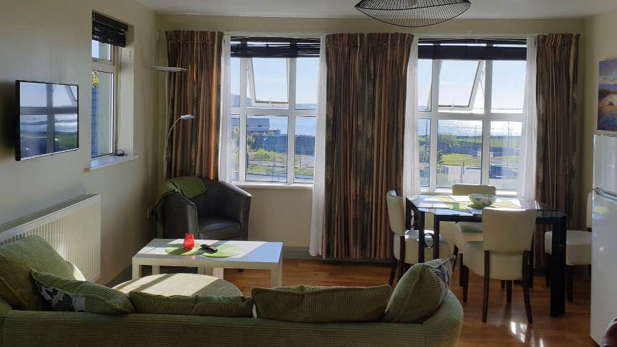 Seating area with couch and table and chair