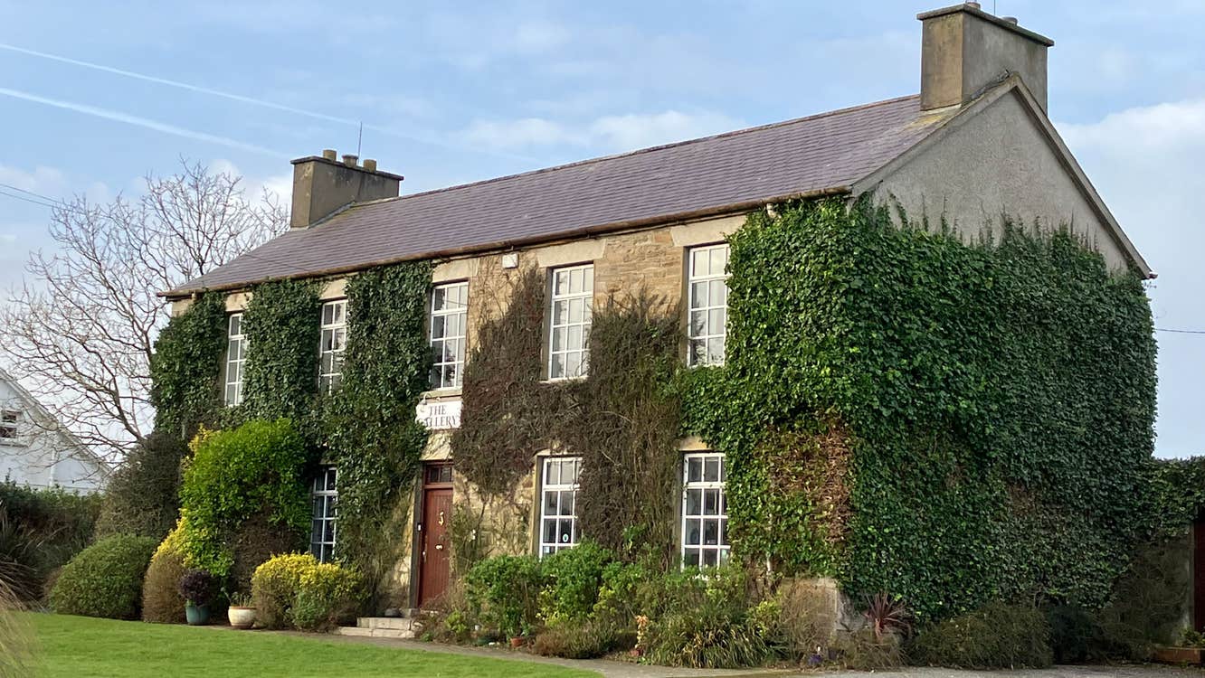 The Gallery of Dunfanaghy exterior of the ivy covered historic house