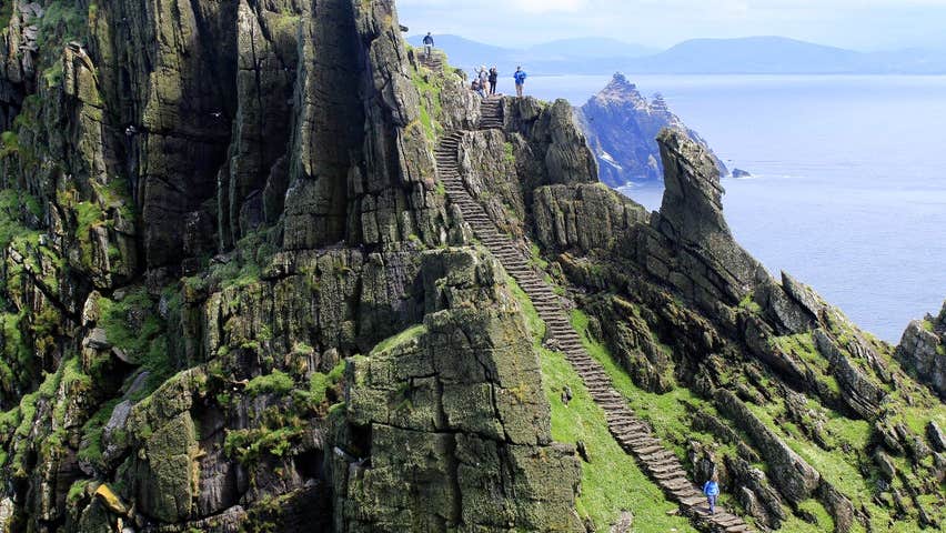 People climbing the steps on Skellig